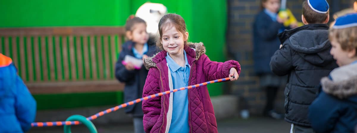 A Sacks Morasha pupil playing a game in the playground