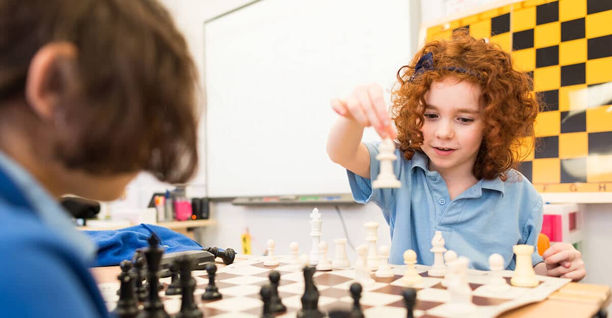 Two girls playing chess at Sacks Morasha Jewish Primary School