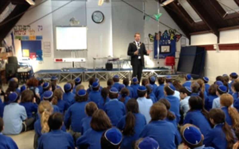 The Mayor addressing pupils in Sacks Morasha's school hall