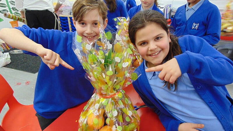 Sacks Morasha pupils with the fruit baskets they created for Tu B’shvat